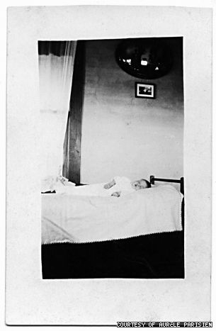 A postcard photo circa-1900 depicting a child moments after passing away.